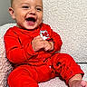 baby, child, infant, smiling, laughing, red_pajamas, couch, indoor, happy, cute, portrait, sitting, hands, barefoot, cozy, texture, closeup, face, expression, home