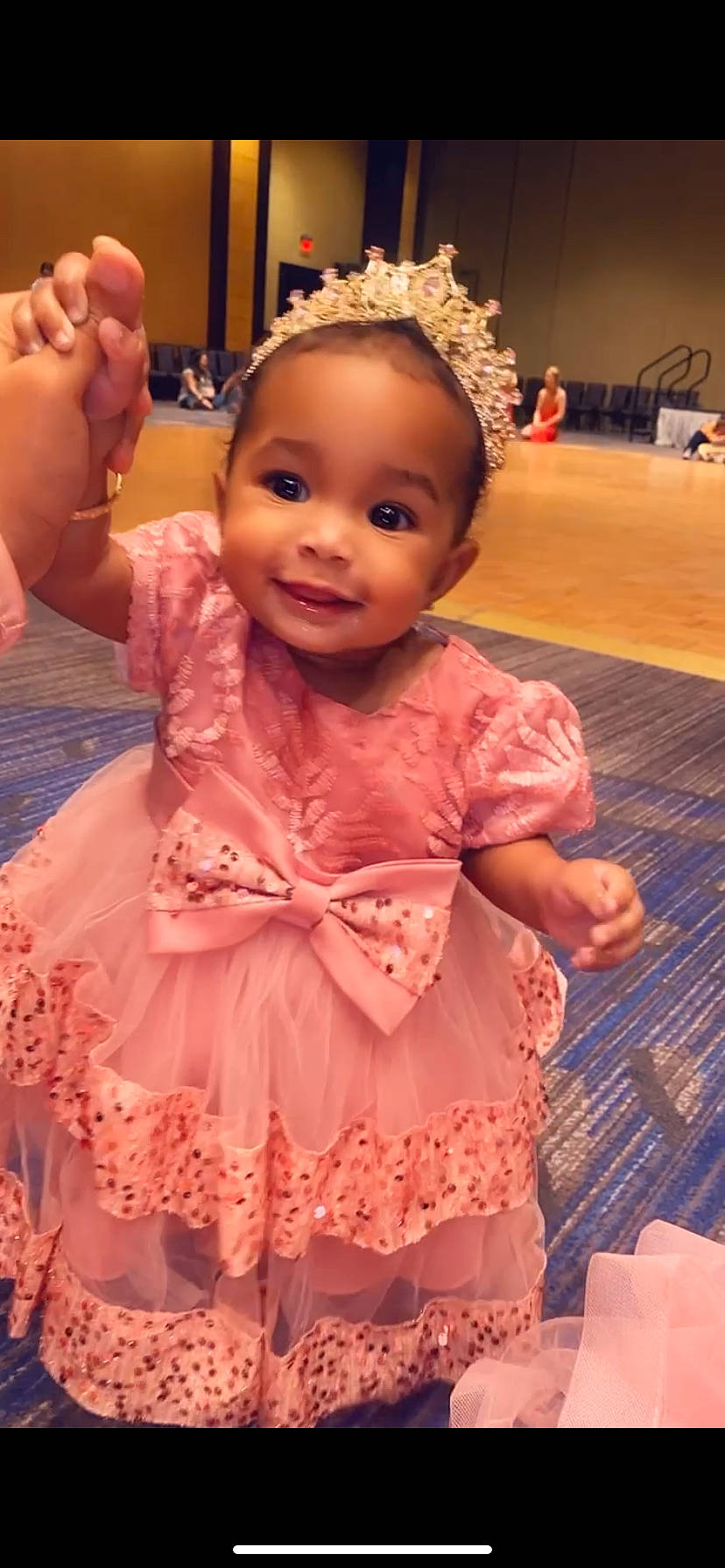 Naylani is registered to the contest to win money with this photo: baby, baby_toddler_clothing, cheek, child, embellishment, event, flooring, fun, gesture, happy, head, headpiece, iris, joy, magenta, peach, person, pink, ruffle, skin