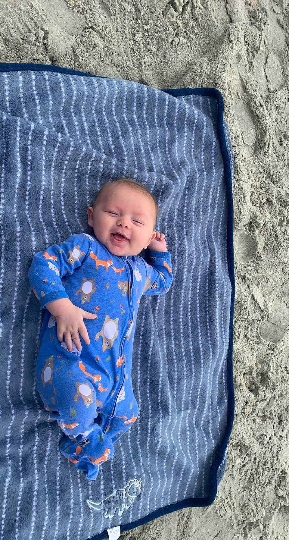Elijah is registered to the contest to win money with this photo: azure, baby, baby_toddler_clothing, child, circle, comfort, electric_blue, eye, fun, grass, linens, pattern, person, sitting, sleeve, smile, t_shirt, toddler
