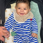 Gabriel participe au concours pour gagner de l'argent avec cette photo : baby, bedtime, blanket, child, comfort, cozy, cute, hand, hand_holding, happy, indoor, infant, pacifier, person, portrait, sleepwear, smiling, striped_pajamas, stroller, toddler