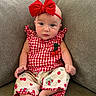 baby, child, infant, portrait, sitting, couch, indoor, bow, headband, red, gingham, dress, cherries, patterned_clothing, barefoot, face, eyes, expression, furniture, cozy