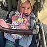 Kailani joined the competition — help win amazing prizes! baby, child, infant, stroller, smiling, happy, bow, headband, toys, teething_toy, colorful, outdoor, pavement, seated, barefoot, portrait, face, carriage, sunlight, baby_gear