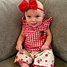 baby, child, infant, sitting, portrait, smiling, bow, headband, red, gingham, outfit, cherries, fruit_pattern, couch, indoor, face, eyes, happy, fashion, photography