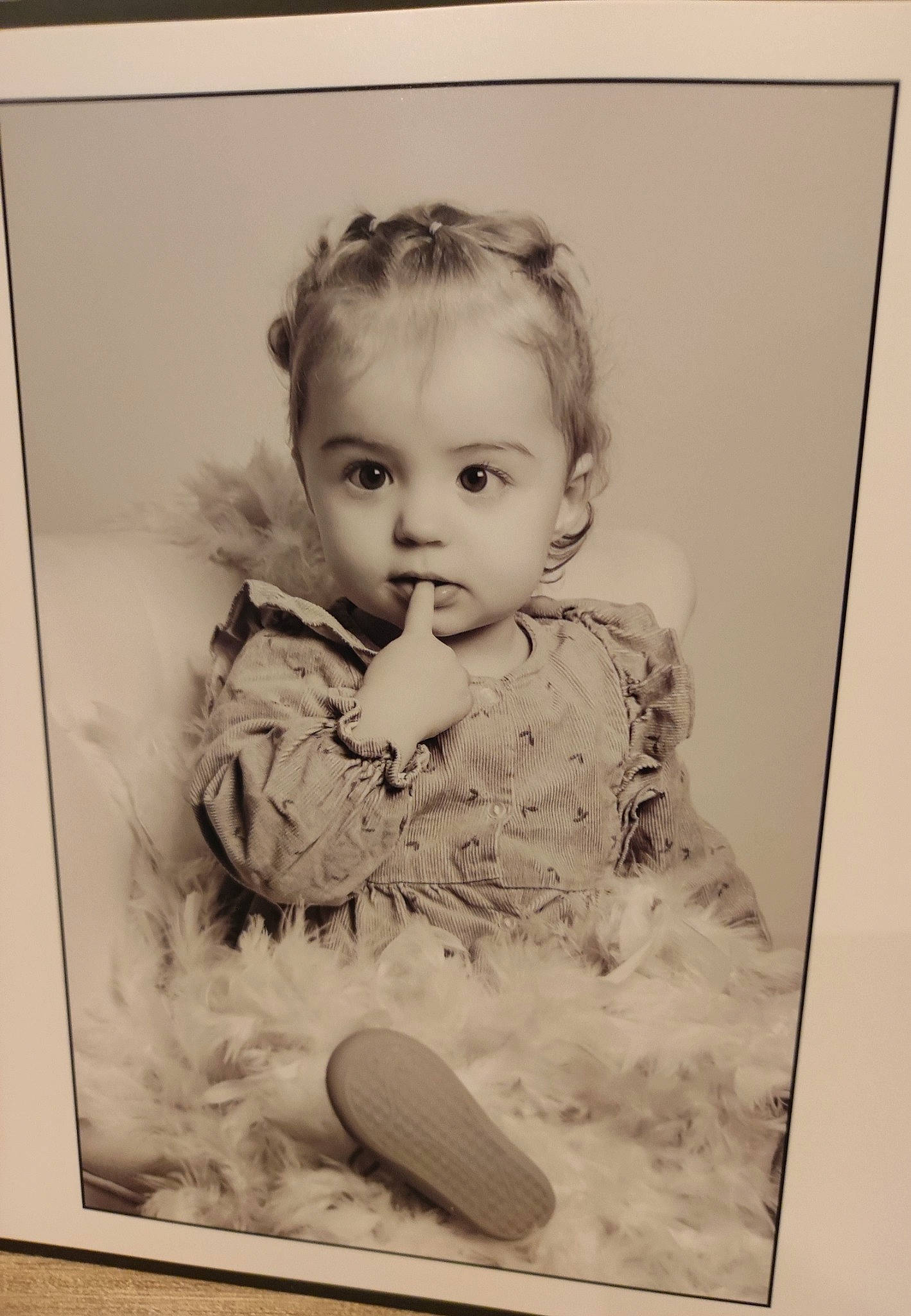 Romane participe au concours pour gagner de l'argent avec cette photo : art, baby, baby_toddler_clothing, cheek, child, eye, facial_expression, iris, monochrome, monochrome_photography, person, picture_frame, portrait, portrait_photography, rectangle, room, sitting, stock_photography, toddler, vintage_clothing