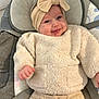 Aélia a rejoint le concours — aidez-le/la à gagner de superbes lots ! baby, infant, child, smiling, headband, bow, beige_outfit, fuzzy_sweater, baby_seat, harness, seat_belt, cozy, cheeks, portrait, indoor, soft_texture, happy, newborn, cute, expression