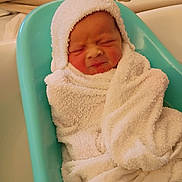 Theodore is registered to the contest to win money with this photo: baby, bath, bathroom, bathtub, blue, child, cute, expression, face, head, indoors, infant, newborn, person, skin, soft, towel, water, white, wrapped
