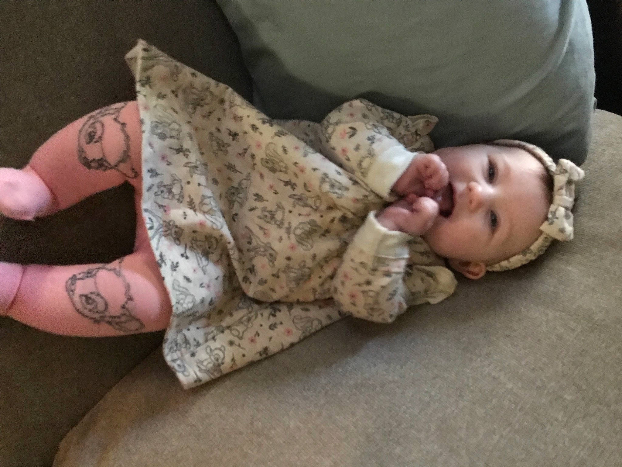 Margot is registered to the contest to win money with this photo: baby, comfort, elbow, finger, flooring, gesture, glasses, headwear, human_body, human_leg, joint, knee, leg, neck, person, shoulder, skin, sleeve, thigh, toddler