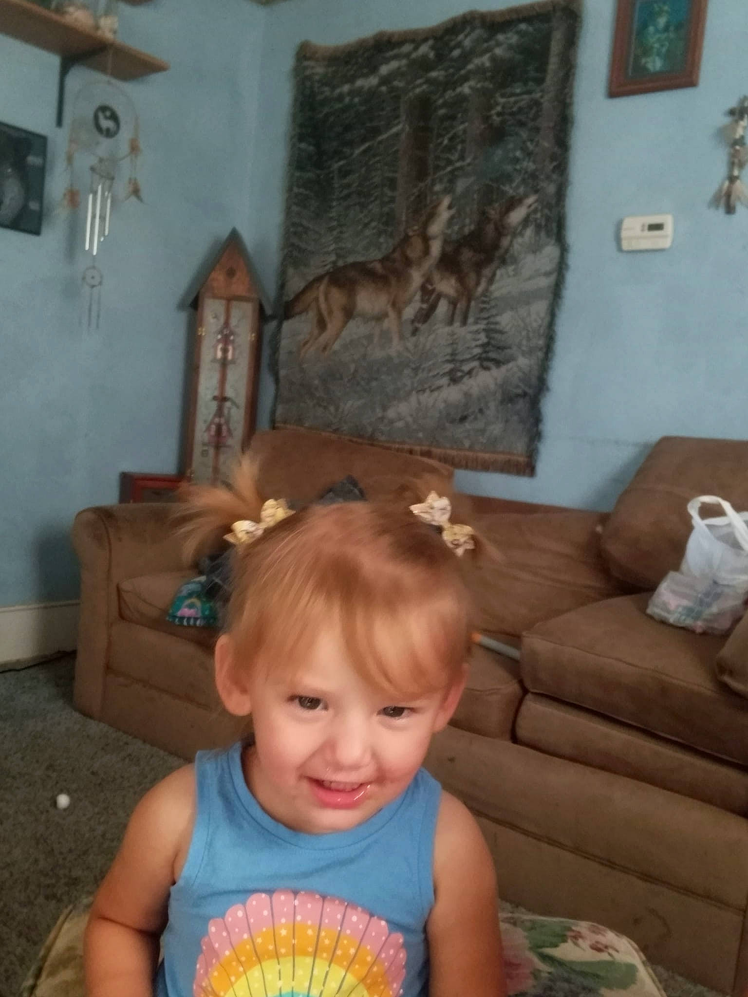 Harlow is registered to the contest to win money with this photo: baby, baby_toddler_clothing, chair, child, comfort, couch, event, flooring, fun, happy, joy, living_room, person, picture_frame, room, sitting, smile, sofa_bed, t_shirt, toddler