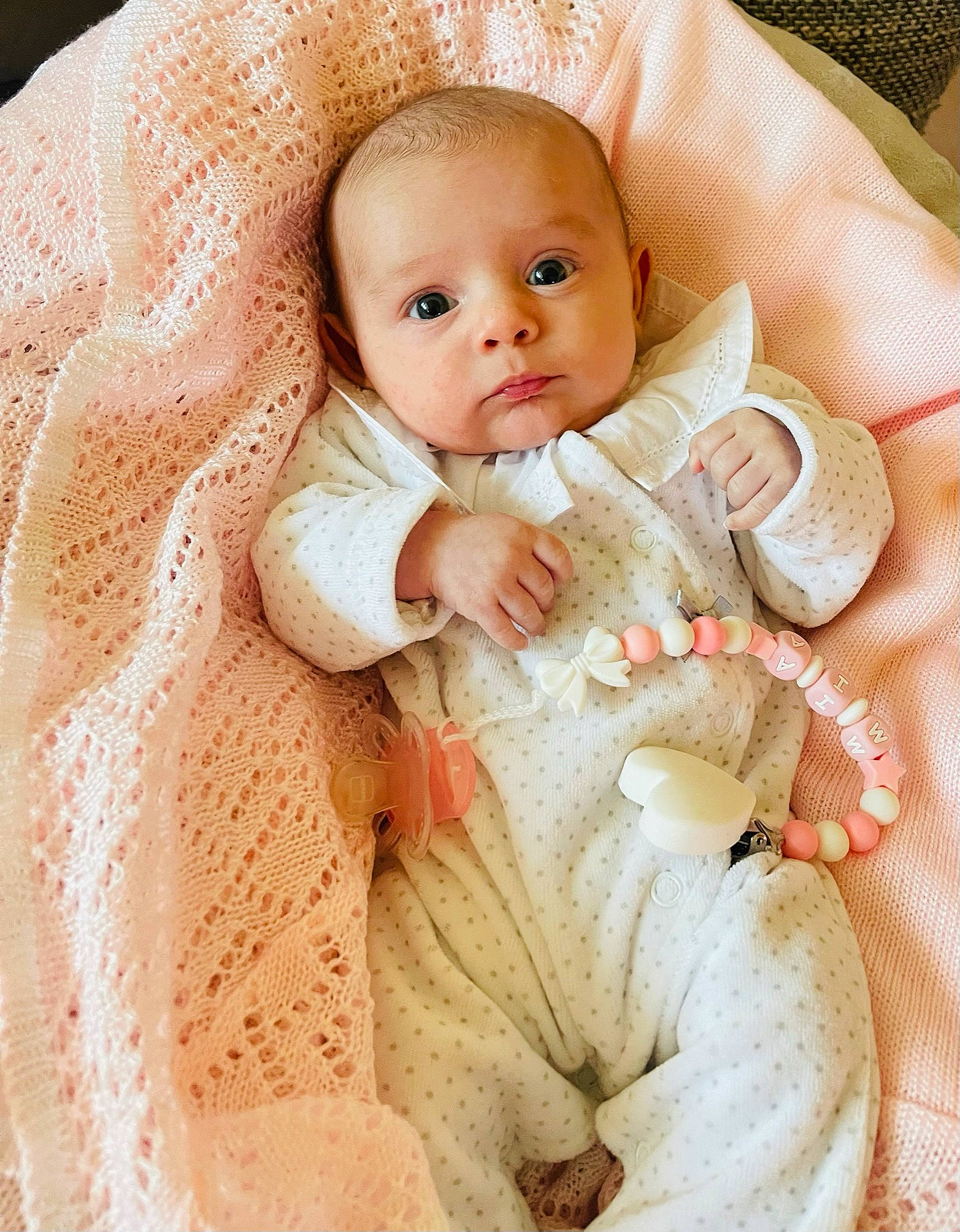 Mia participe au concours pour gagner de l'argent avec cette photo : baby, baby_products, baby_sleeping, baby_toddler_clothing, bedding, cheek, child, collar, comfort, face, fashion_accessory, fur, linens, pattern, peach, person, pink, sitting, skin, sleeve