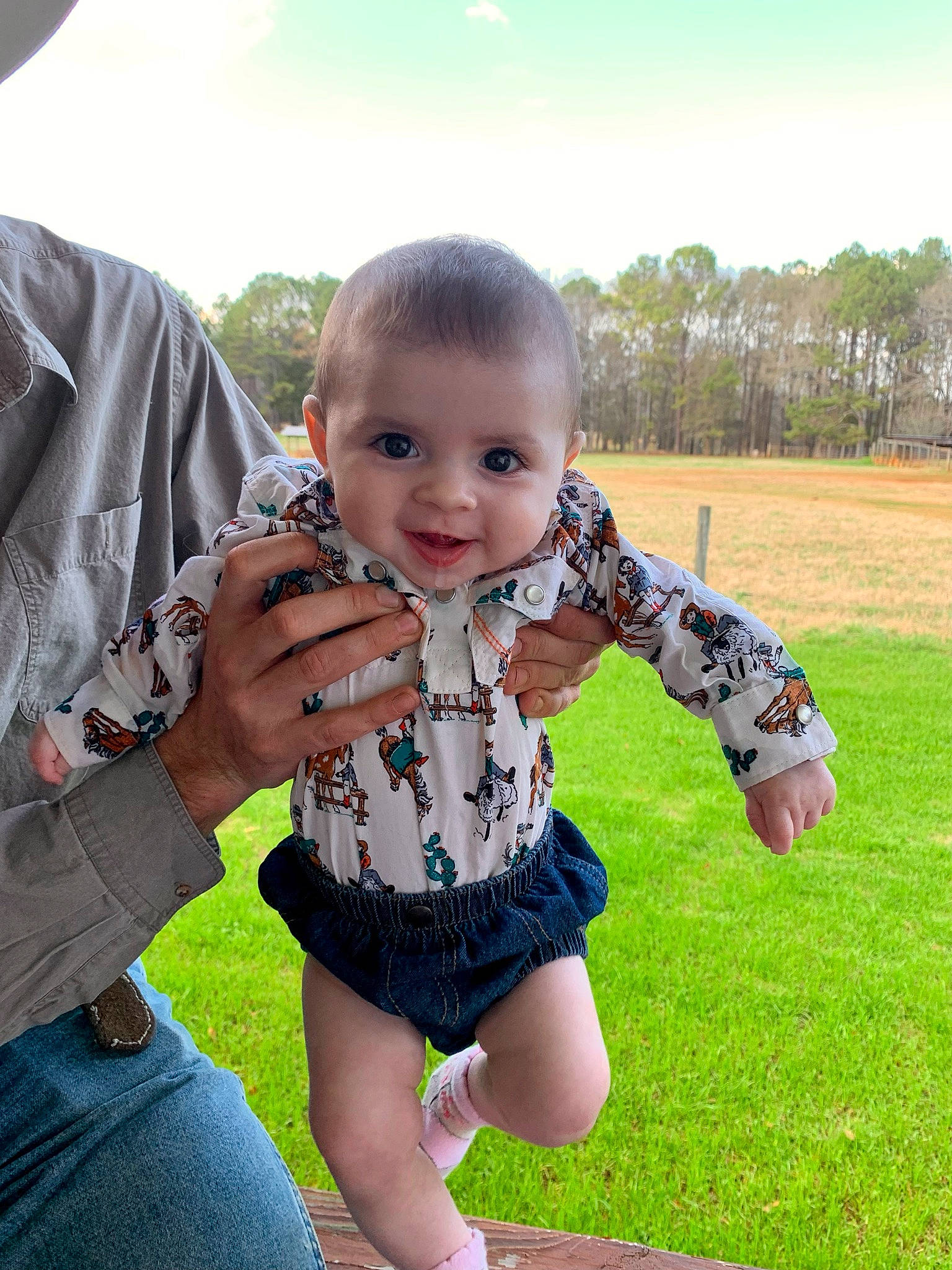 Jody joined the competition — help win amazing prizes! baby, baby_toddler_clothing, eye, face, finger, fun, gesture, grass, happy, iris, leisure, people_in_nature, person, plant, skin, sky, sleeve, smile, standing, thumb