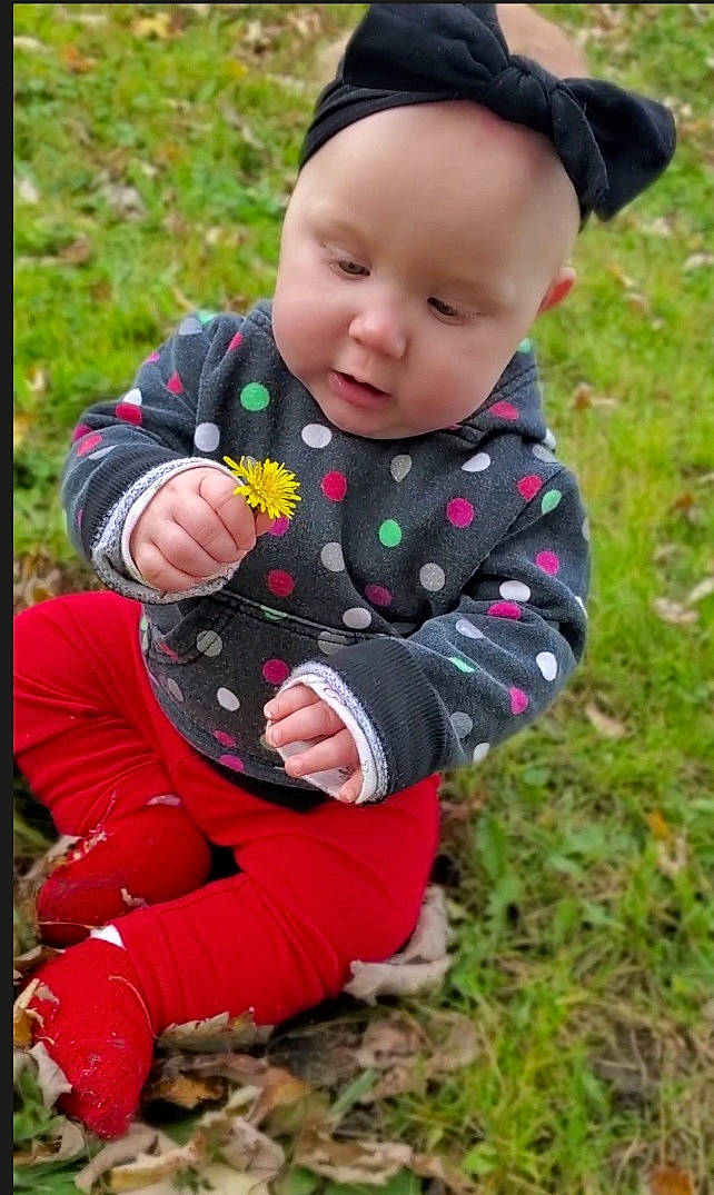 Emma joined the competition — help win amazing prizes! baby, baby_toddler_clothing, ball, cap, child, clothing, fun, grass, hand, happy, hat, headwear, outerwear, pattern, people_in_nature, person, pink, plant, sitting, sleeve