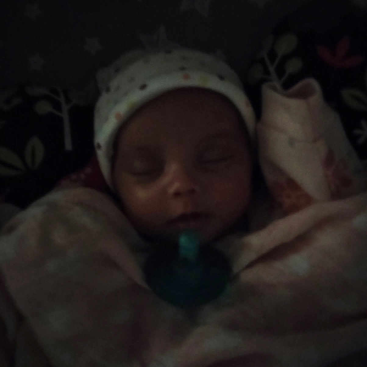 Lulu is registered to the contest to win money with this photo: architecture, baby, bed, blanket, bonnet, building, cap, clothing, face, furniture, glove, hat, head, homedecor, newborn, person, photography, portrait, quilt, sleeping