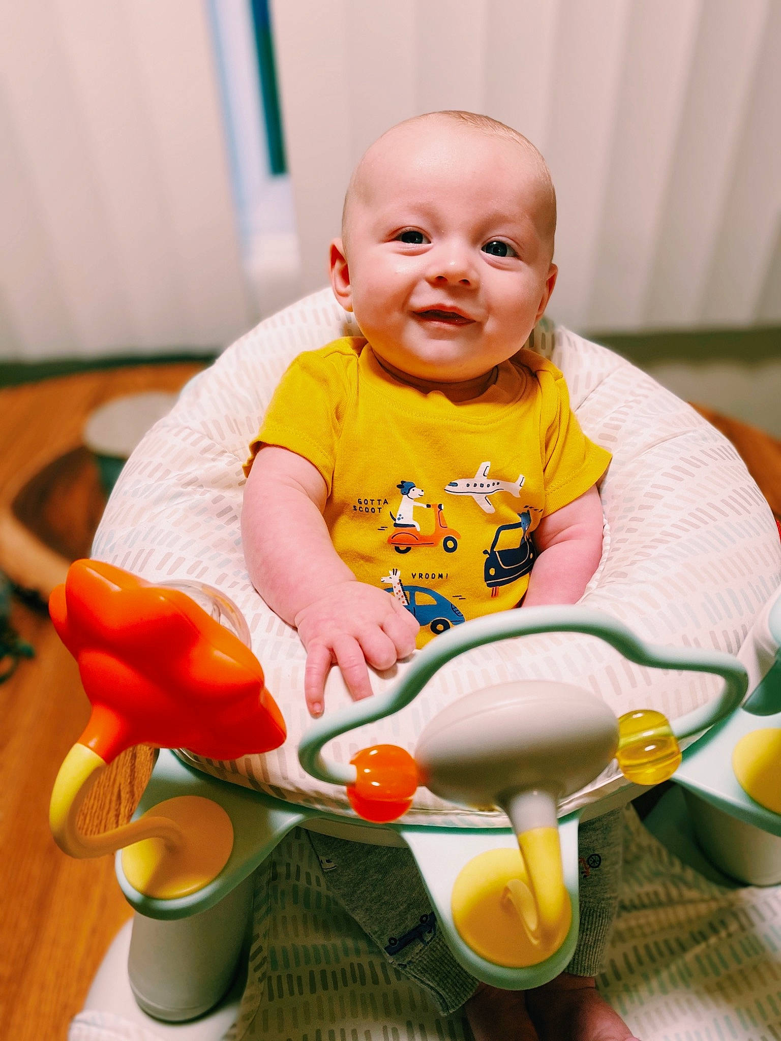 Weston joined the competition — help win amazing prizes! baby, baby_laughing, baby_playing_with_toys, baby_products, baby_toddler_clothing, child, comfort, fun, happy, orange, person, product, riding_toy, sitting, skin, smile, tire, toddler, toy, wheel