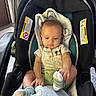 Xander is registered to the contest to win money with this photo: baby, car_seat, blanket, mickey_mouse, socks, infant, child, cute, clothing, seat, indoor, person, young_child, casual, comfort, soft_lighting, focus, adorable, babywear, relaxed