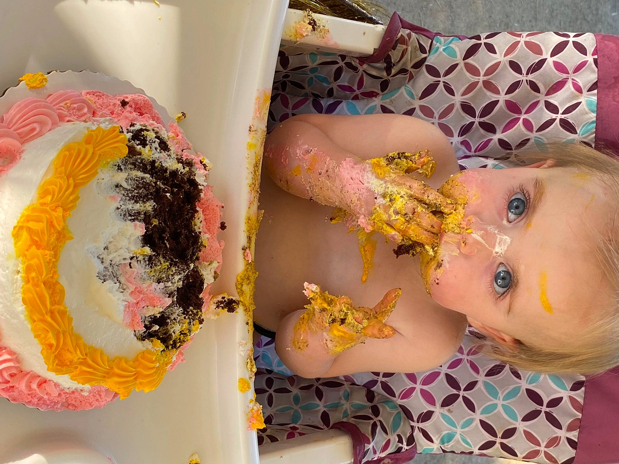 Esme is registered to the contest to win money with this photo: art, baby, baby_toys, baking, child, eyelash, fashion_accessory, finger_food, human, ingredient, nail, paint, pattern, person, pink, room, sweetness, textile, toddler, toy
