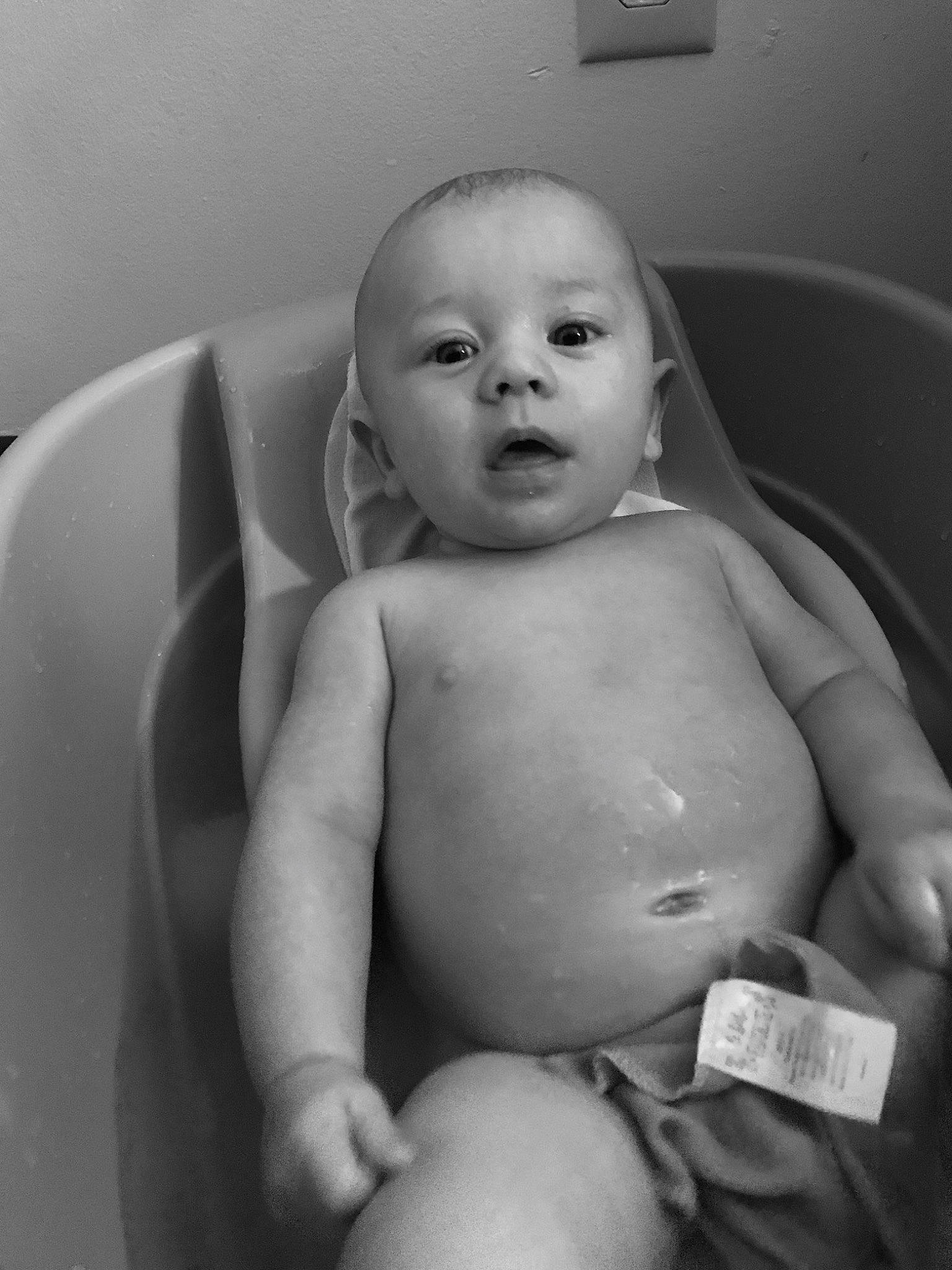 Leeland is registered to the contest to win money with this photo: baby, birth, black, black_and_white, chest, child, eye, face, hand, head, monochrome, monochrome_photography, person, photography, skin, smile, stomach, style, toddler, trunk