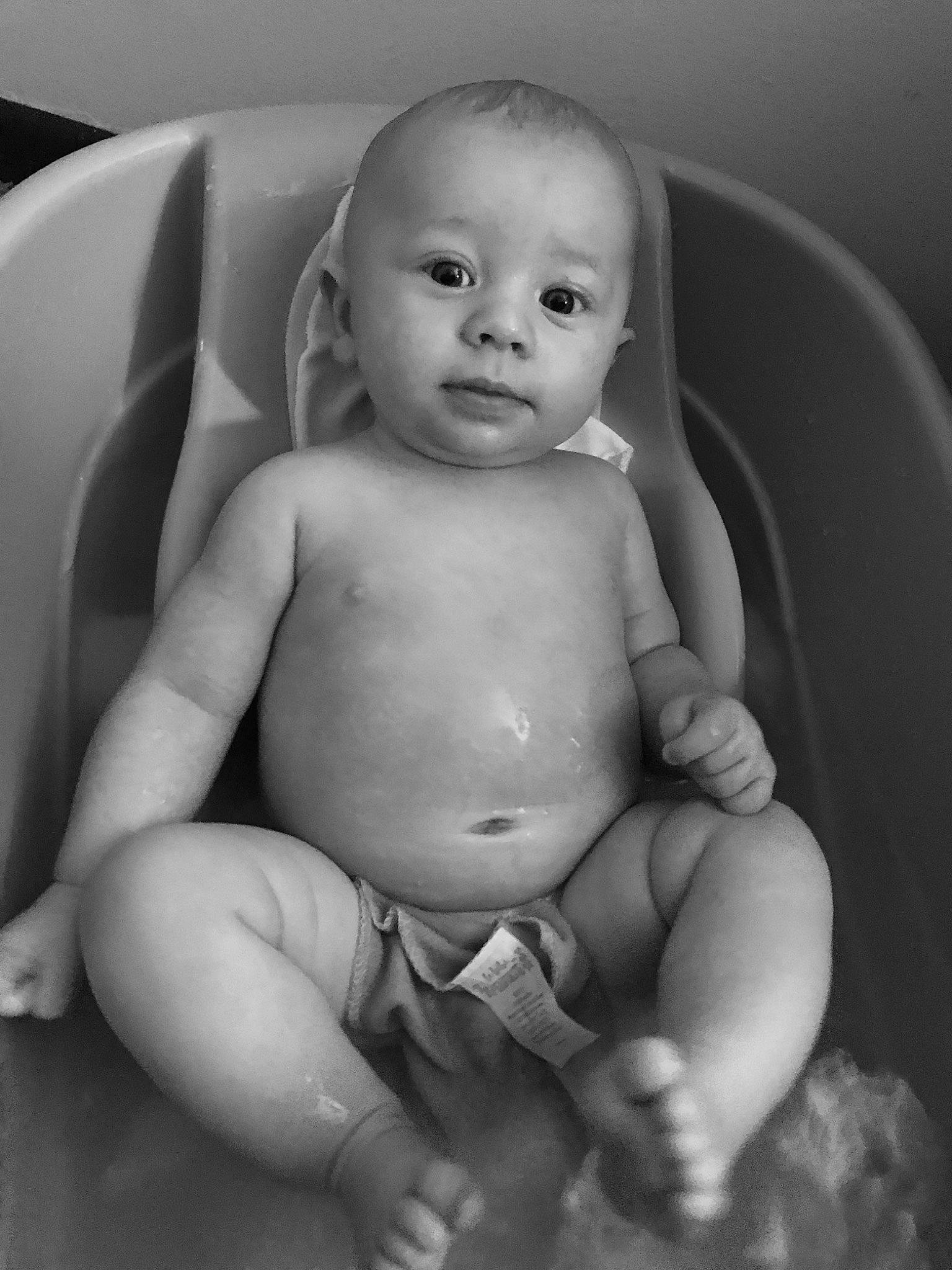 Leeland is registered to the contest to win money with this photo: baby, black, black_and_white, cheek, child, eye, face, finger, hand, head, lip, monochrome, monochrome_photography, mouth, nose, person, photography, skin, stomach, toddler