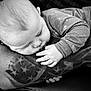 arm, baby, black_and_white, calm, close_up, clothing, couch, cute, face, hand, infant, monochrome, newborn, pattern, peaceful, portrait, resting, skin, sleeping, tattoo