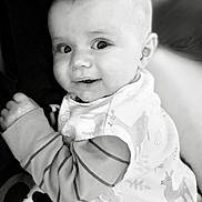 Brody joined the competition — help win amazing prizes! baby, child, smiling, black_and_white, portrait, infant, face, cute, apparel, striped_sleeves, bib, close_up, person, expression, happy, young, skin, head, eyes, hand