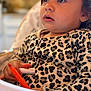 Charli a rejoint le concours — aidez-le/la à gagner de superbes lots ! animal_print_clothing, child, clothing, curious, expression, face, hand, high_chair, indoor, kitchen, leopard_print, long_hair, marker, orange_marker, person, portrait, sitting, skin, toddler, young_child