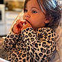Charli a rejoint le concours — aidez-le/la à gagner de superbes lots ! baby, child, clothing, curly_hair, cute, expression, face, focused, furniture, hands, high_chair, indoor, kitchen, leopard_print, person, playing, portrait, seat, toddler, young_child