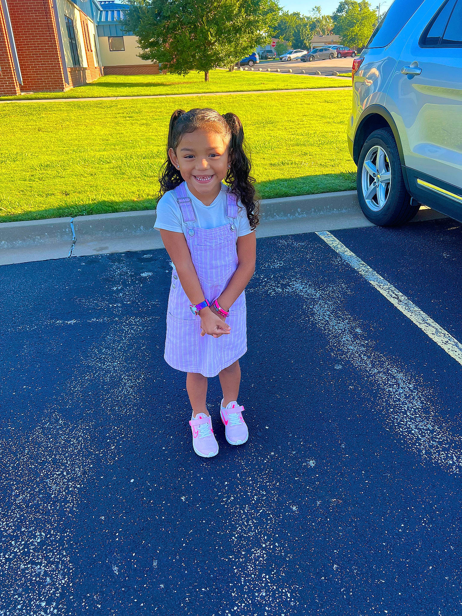 Lilyana joined the competition — help win amazing prizes! asphalt, blue, car, city, electric_blue, fun, grass, joy, leisure, motor_vehicle, person, plant, recreation, road, road_surface, sidewalk, tire, toddler, tree, vehicle_door