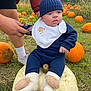 baby, infant, pumpkin, pumpkin_patch, grass, outdoor, beanie, bib, socks, person, hand, orange_pumpkin, white_pumpkin, fall, autumn, nature, field, cute, child, support