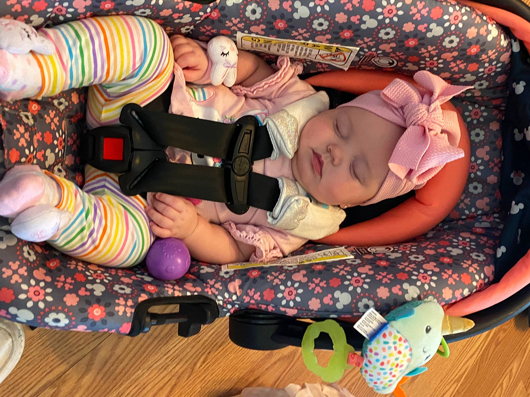 Kinsley is registered to the contest to win money with this photo: arm, baby, baby_products, baby_toddler_clothing, cheek, child, comfort, finger, fun, hand, happy, headwear, human_leg, lap, nail, pattern, person, pink, sitting, tableware
