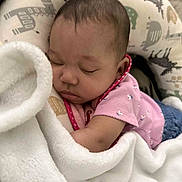 Ameriah joined the competition — help win amazing prizes! baby, sleeping, blanket, cushion, infant, soft, cozy, patterned, animal_prints, pink_clothing, peaceful, resting, child, face, head, comfort, indoors, young, portrait, toddler