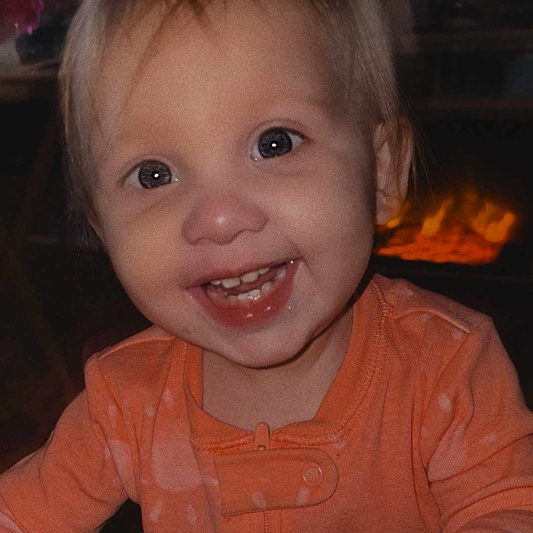 Bailee is registered to the contest to win money with this photo: architecture, baby, babylaughing, bodypart, building, clothing, face, fireplace, happy, head, indoors, laughing, mouth, person, photography, portrait, sitting, smile, t_shirt, teeth