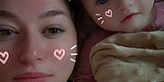 Ava Lee is registered to the contest to win money with this photo: woman, baby, face, portrait, selfie, lying_down, blanket, pink_clothing, digital_filter, cat_ears, heart_doodles, skin, eyes, head, hand, closeup, indoor, cute, family, together