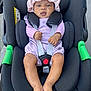 baby, baby_fashion, bare_feet, black_car_seat, car_seat, child, curious_expression, cute, footwearless, hat, headwear, infant, legs, outdoor, purple_clothing, safety_harness, sitting, small_hands, straps, toddler