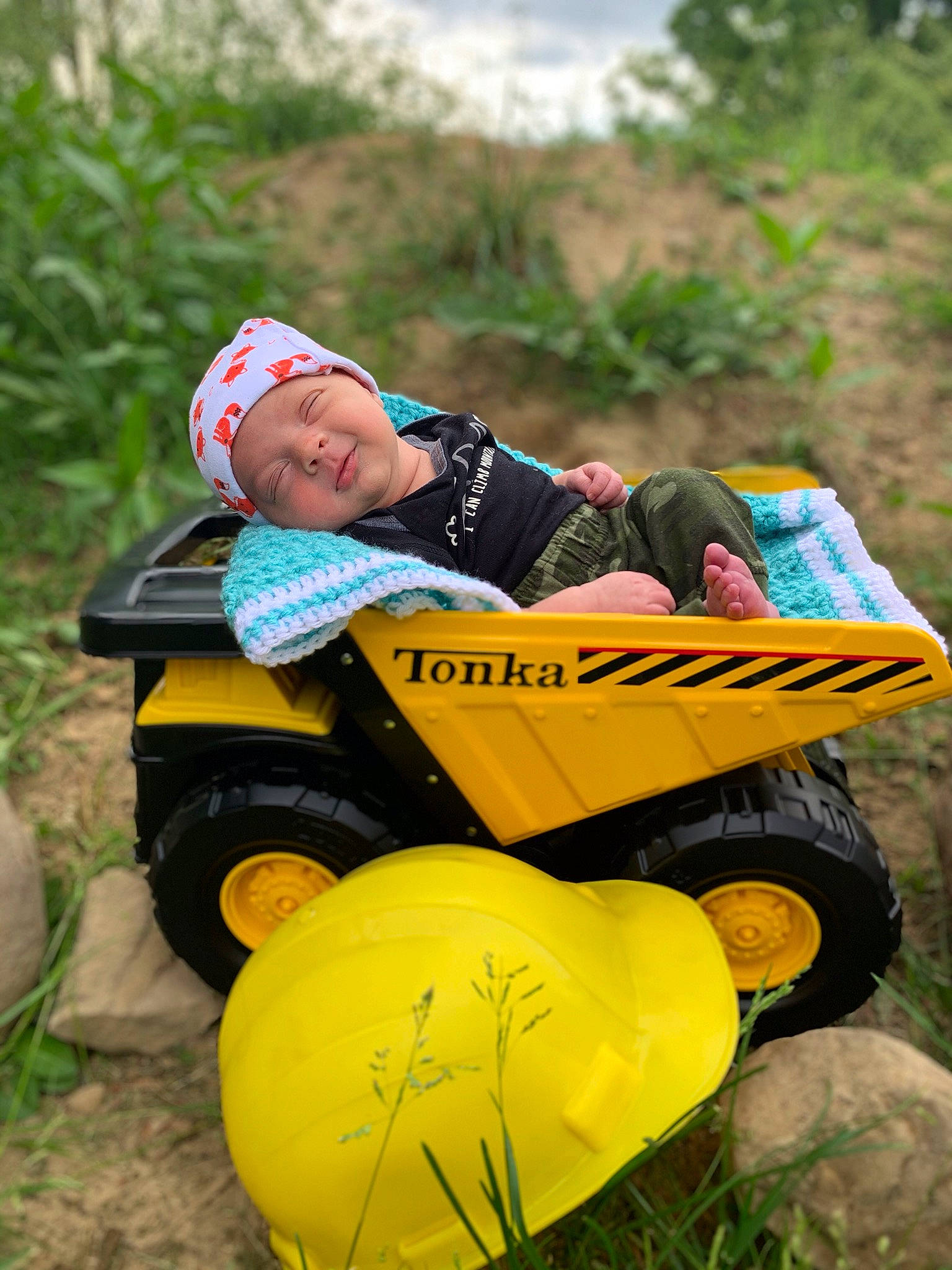 Beau joined the competition — help win amazing prizes! child, fun, grass, happy, headwear, leisure, person, play, recreation, sitting, smile, toddler, tree, vehicle, yellow