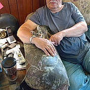 Mickey joined the competition — help win amazing prizes! armchair, cat, clutter, couch, cozy, glasses, indoor, jeans, kitten, living_room, man, mustache, pet, remote_control, senior, side_table, telephone, tumbler, upholstery, watch