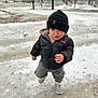 Koa is registered to the contest to win money with this photo: baby, cap, clothing, coat, face, footwear, glove, hat, head, ice, jacket, outdoors, pants, person, photography, plant, portrait, shoe, tree, vegetation
