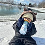 baby, cap, clothing, coat, cream, dessert, face, food, glove, hat, head, ice, jacket, nature, outdoors, pants, person, photography, portrait, soil