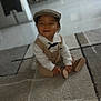 Kayden participe au concours pour gagner de l'argent avec cette photo : baby, child, smile, hat, cap, vest, shirt, carpet, indoor, floor, happy, person, footwear, sitting, toddler, cute, portrait, home, clothing, young