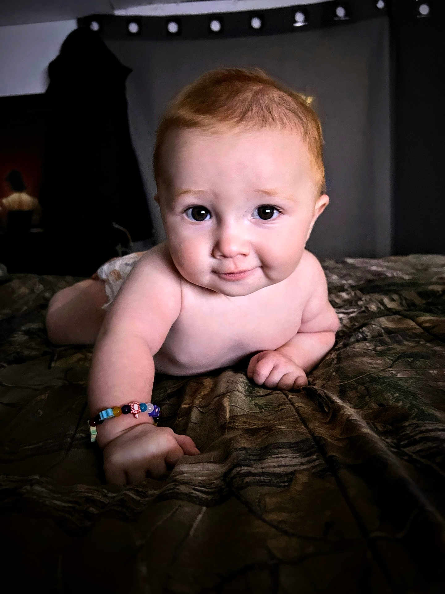 Oliver is registered to the contest to win money with this photo: baby, infant, crawling, bracelet, bedspread, smile, face, skin, arm, hand, indoors, closeup, expression, cute, child, person, young, portrait, curious, light