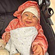 Lana participe au concours pour gagner de l'argent avec cette photo : baby, babywear, blanket, child, clothing, cozy, cute, face, hands, happy, hat, infant, jacket, outdoor, portrait, seated, smiling, stroller, warm, young