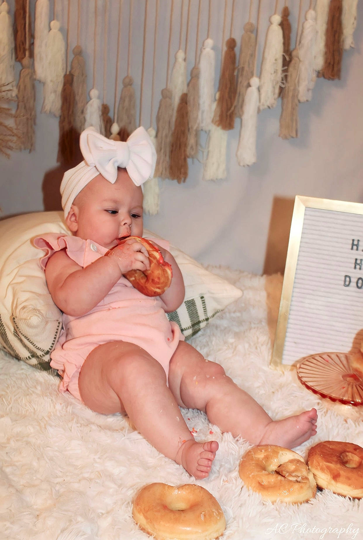 Averi is registered to the contest to win money with this photo: baby, baby_toddler_clothing, baking, bread, bread_roll, child, comfort, cooking, cuisine, curtain, dish, finger_food, food, gluten, ingredient, junk_food, peach, person, room, tableware