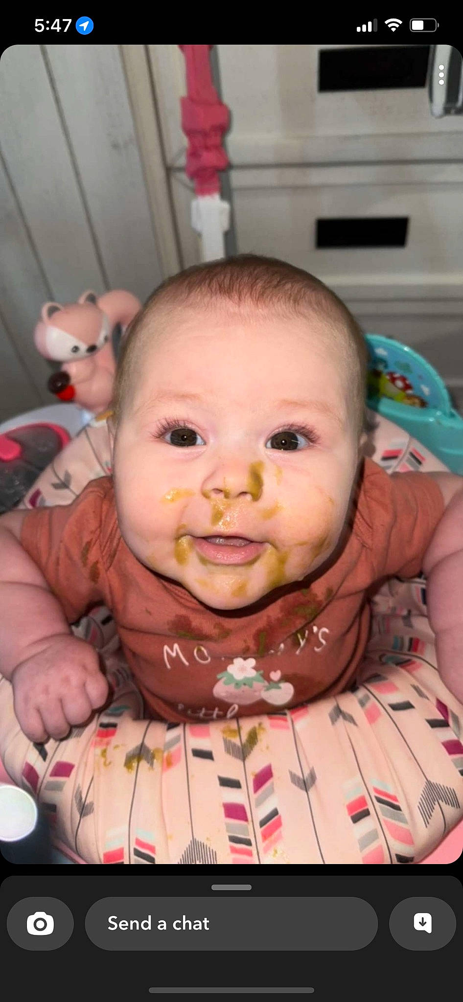 Averi joined the competition — help win amazing prizes! baby, baby_toddler_clothing, bib, chair, cheek, child, drinkware, eye, eyebrow, eyelash, food, forehead, happy, iris, lip, mouth, nose, person, skin, tableware