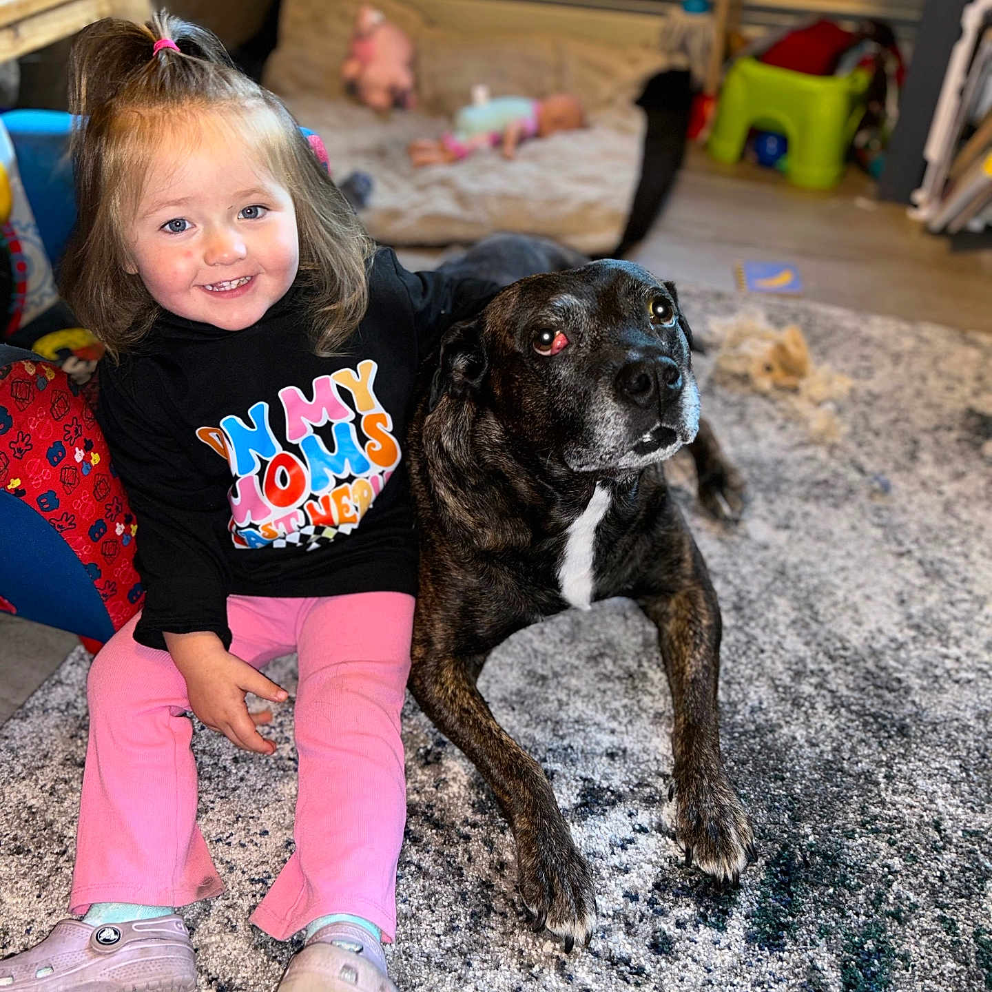 Oaklyn is registered to the contest to win money with this photo: animal, canine, child, clothing, couch, dog, face, female, footwear, furniture, girl, head, pants, person, pet, photography, portrait, puppy, shoe, sitting