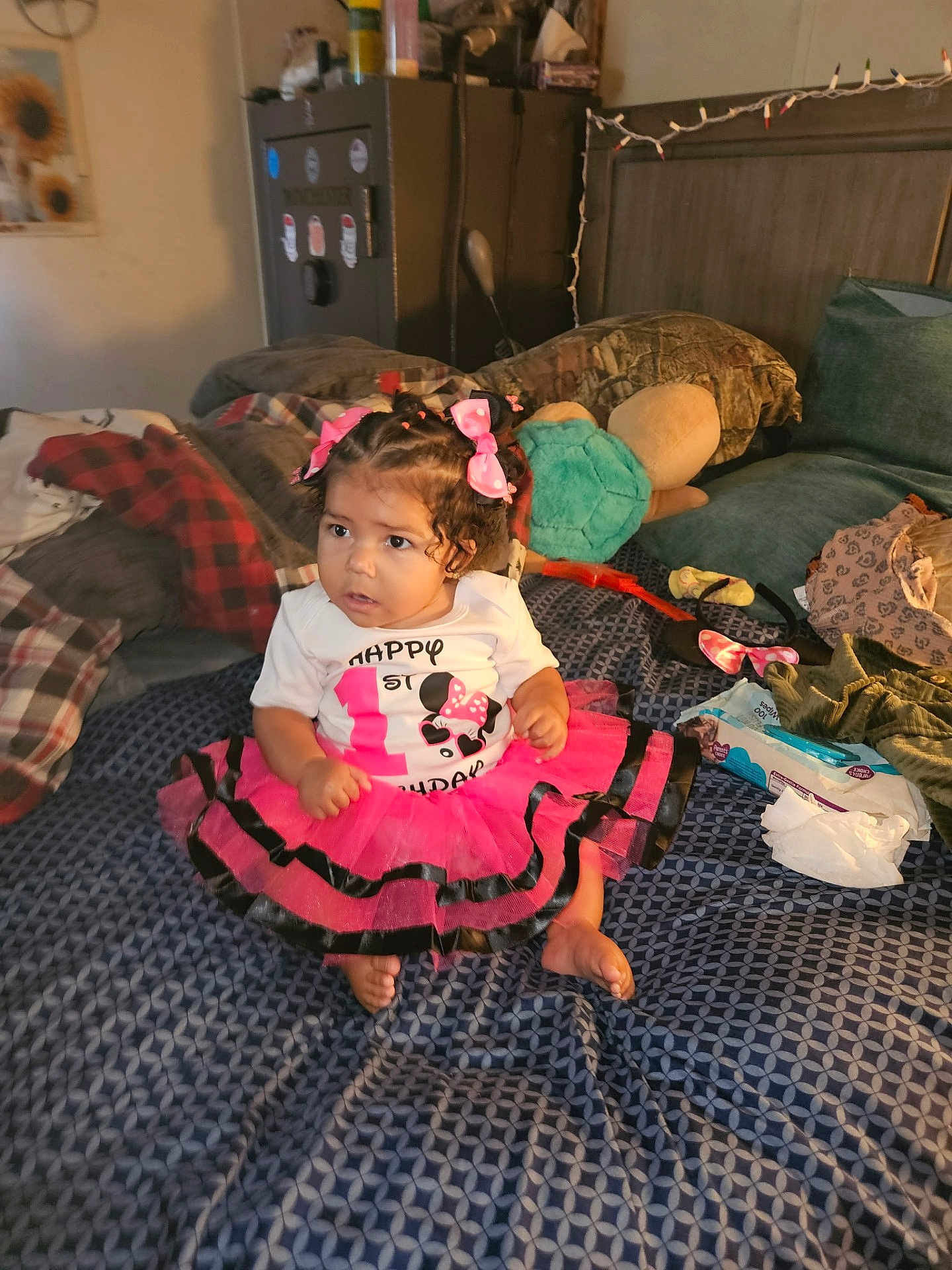 Za'Liyah joined the competition — help win amazing prizes! toddler, child, pink_bow, tutu_skirt, curly_hair, bed, pillows, stuffed_toy, blanket, clothing, indoor, baby_wipes, patterned_bedspread, decor, hair_bows, footwear, sitting, cute, celebration, room