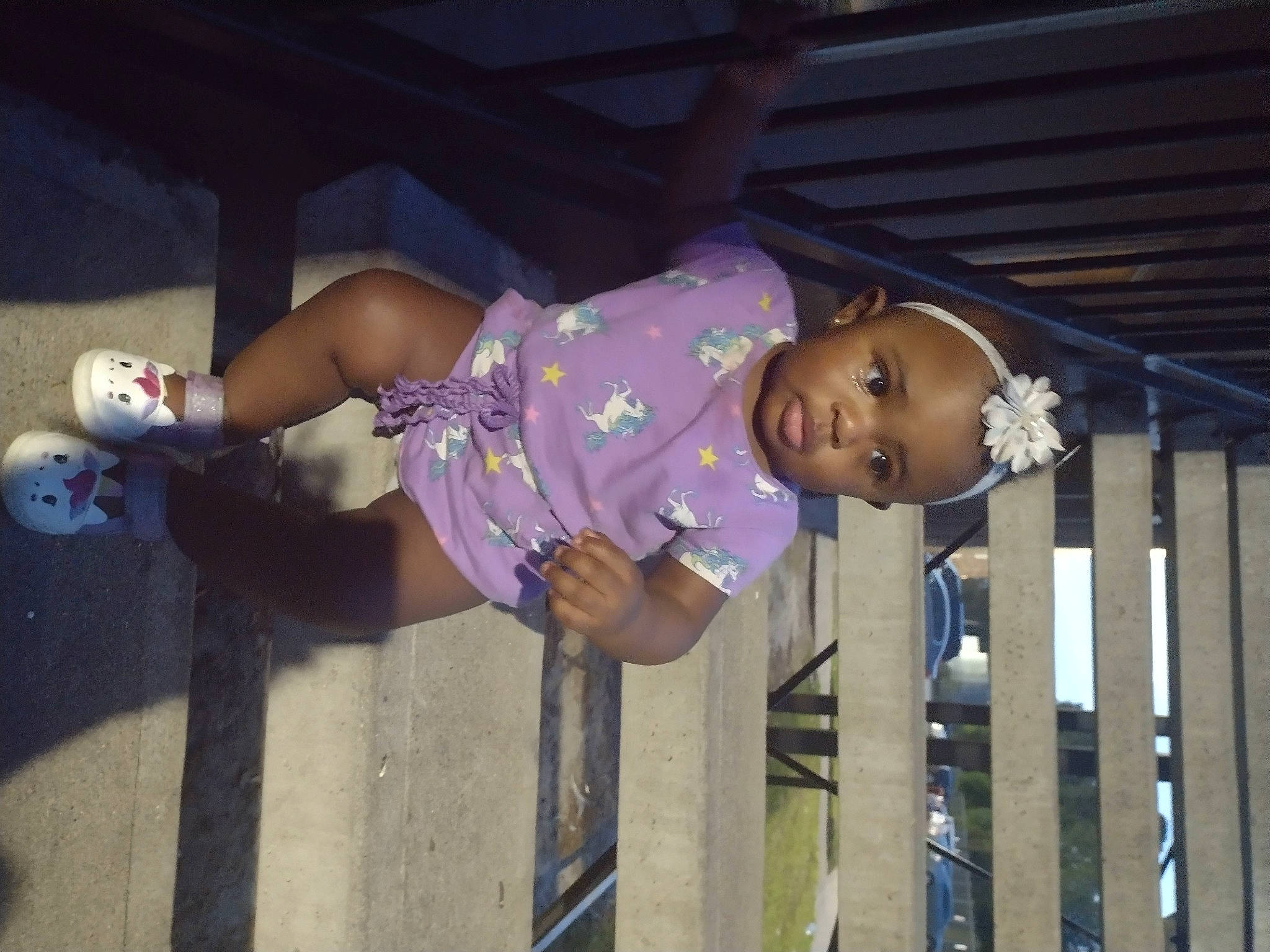 Malaysia is registered to the contest to win money with this photo: baby, baby_toddler_clothing, child, face, fence, fun, happy, hat, human_leg, leisure, magenta, person, purple, smile, thigh, toddler, tree, vacation