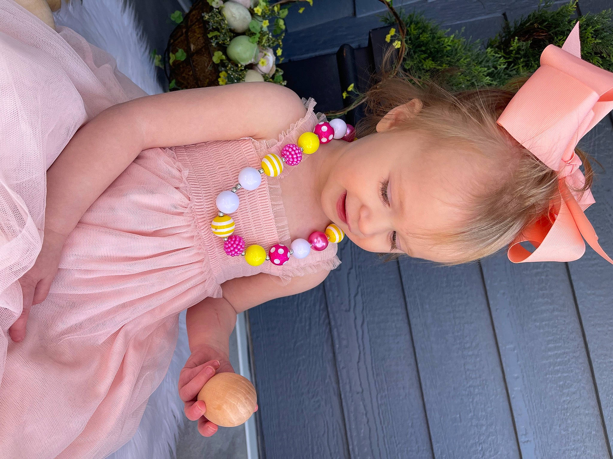 Pyper joined the competition — help win amazing prizes! baby_toddler_clothing, child, dress, event, facial_expression, finger, fun, hair_accessory, hand, happy, headpiece, jewellery, nail, orange, pattern, person, pink, plant, product, skin