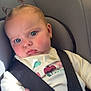 Ambre participe au concours pour gagner de l'argent avec cette photo : baby, child, car_seat, blue_eyes, hair_ties, pony_tail, seatbelt, rosy_cheeks, curious_expression, infant, clothing, sitting, indoors, portrait, safety, cute, soft_light, hand, face, young