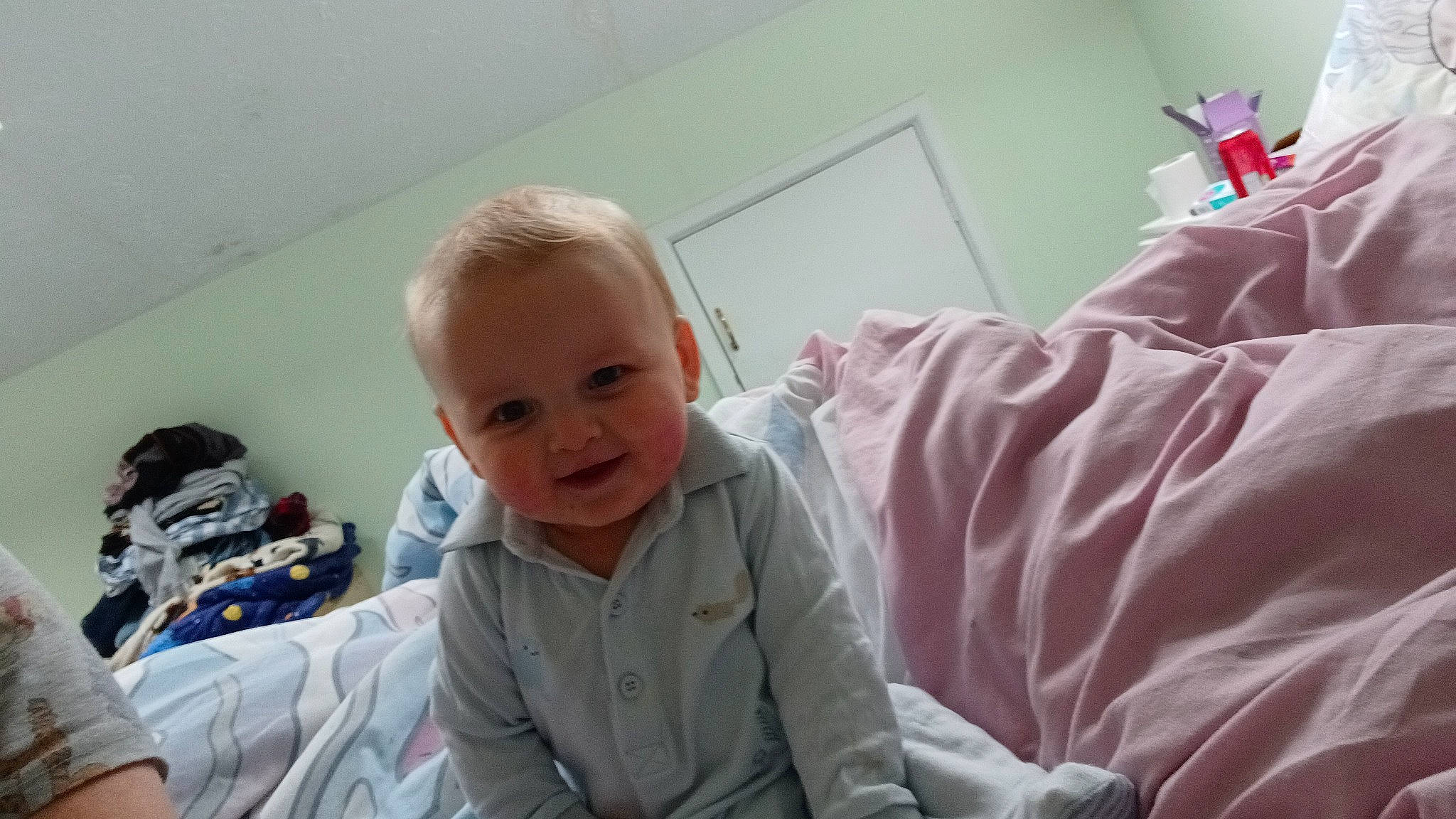 Finley joined the competition — help win amazing prizes! baby, baby_products, baby_toddler_clothing, bed, bedding, child, comfort, fun, happy, laugh, linens, magenta, person, room, sitting, sleeve, smile, t_shirt, toddler