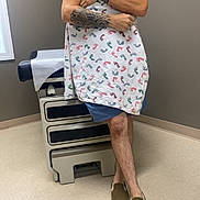 Roy joined the competition — help win amazing prizes! man, baby, newborn, tattoo, cap, sunglasses, blanket, footprint_pattern, hospital_room, medical_bed, floor, wall, shorts, shoes, holding, cradling, indoor, person, care, tenderness