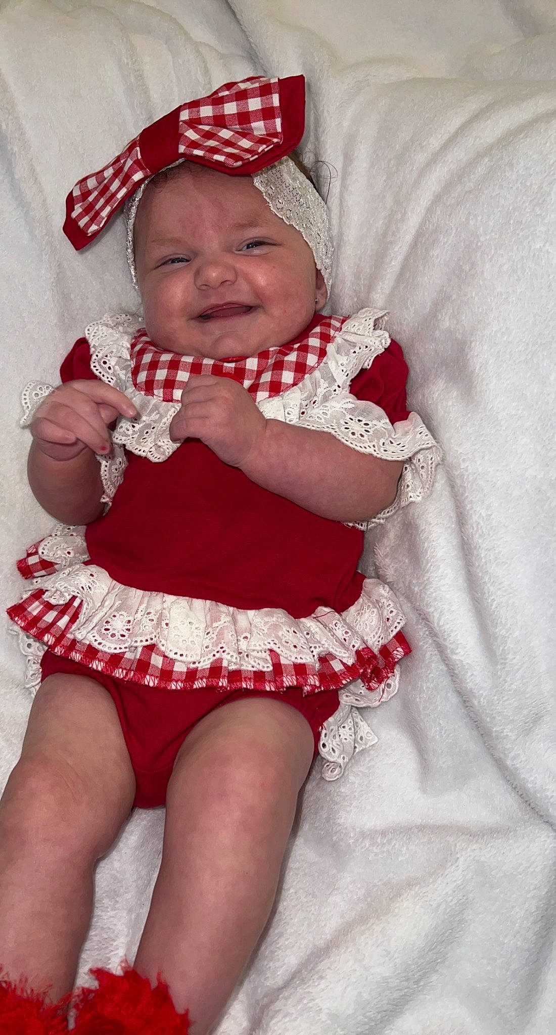 Melissalynn is registered to the contest to win money with this photo: baby, baby_toddler_clothing, child, day_dress, dress, face, finger, gesture, happy, headgear, headwear, human_body, pattern, person, pink, red, skin, sleeve, smile, textile