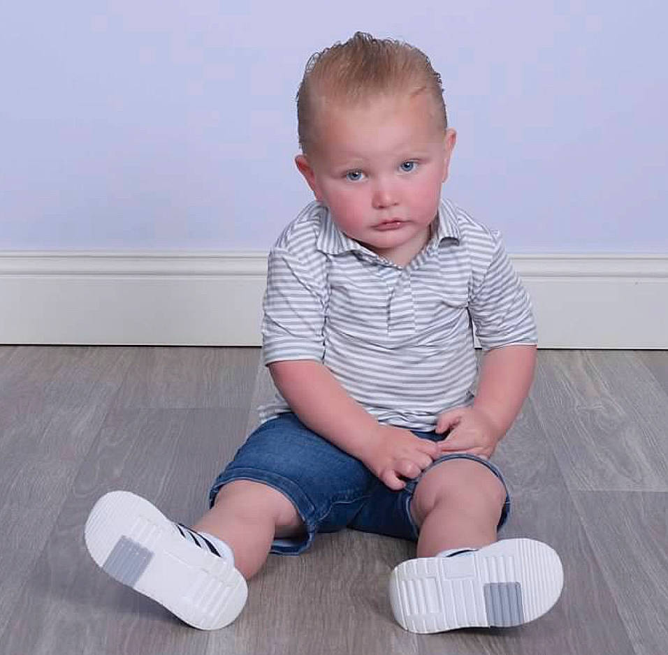 Josiah joined the competition — help win amazing prizes! baby_toddler_clothing, child, comfort, elbow, electric_blue, flooring, foot, hardwood, human_leg, joint, knee, leg, pattern, person, sitting, skin, sleeve, sock, thigh, toddler